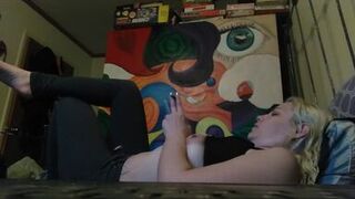 Hot blonde smokes clove cigarettes, plays on phone and plays with tits - 1 image