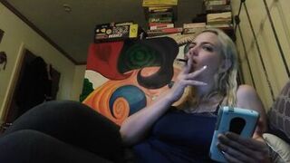 Hot blonde smokes clove cigarettes, plays on phone and plays with tits - 3 image