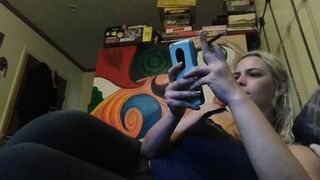 Hot blonde smokes clove cigarettes, plays on phone and plays with tits - 5 image