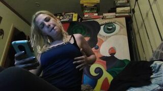 Hot blonde smokes clove cigarettes, plays on phone and plays with tits